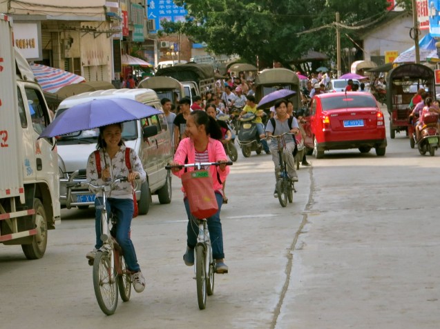 Daxin from the back of a three wheel taxi